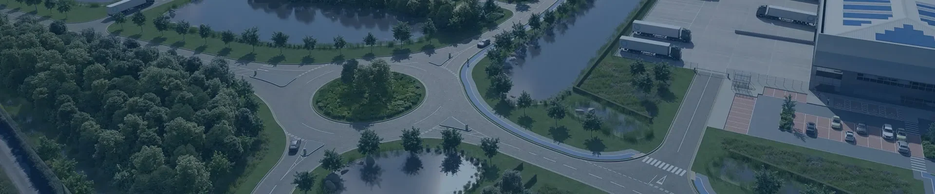 Large roundabout surrounded by trees and grass areas